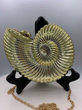 New, no tags, hard acrylic clamshell, clutch purse, mirror gold, fully lined